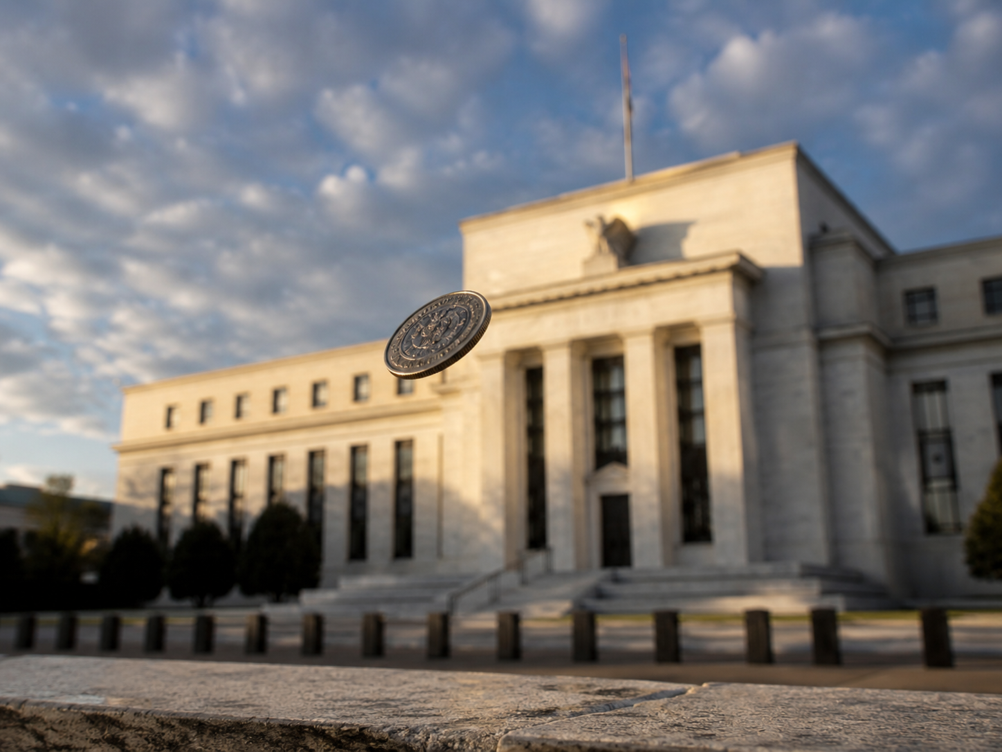 Wall Street Calls It a Coin Flip on the Fed. The Coins Disagree.